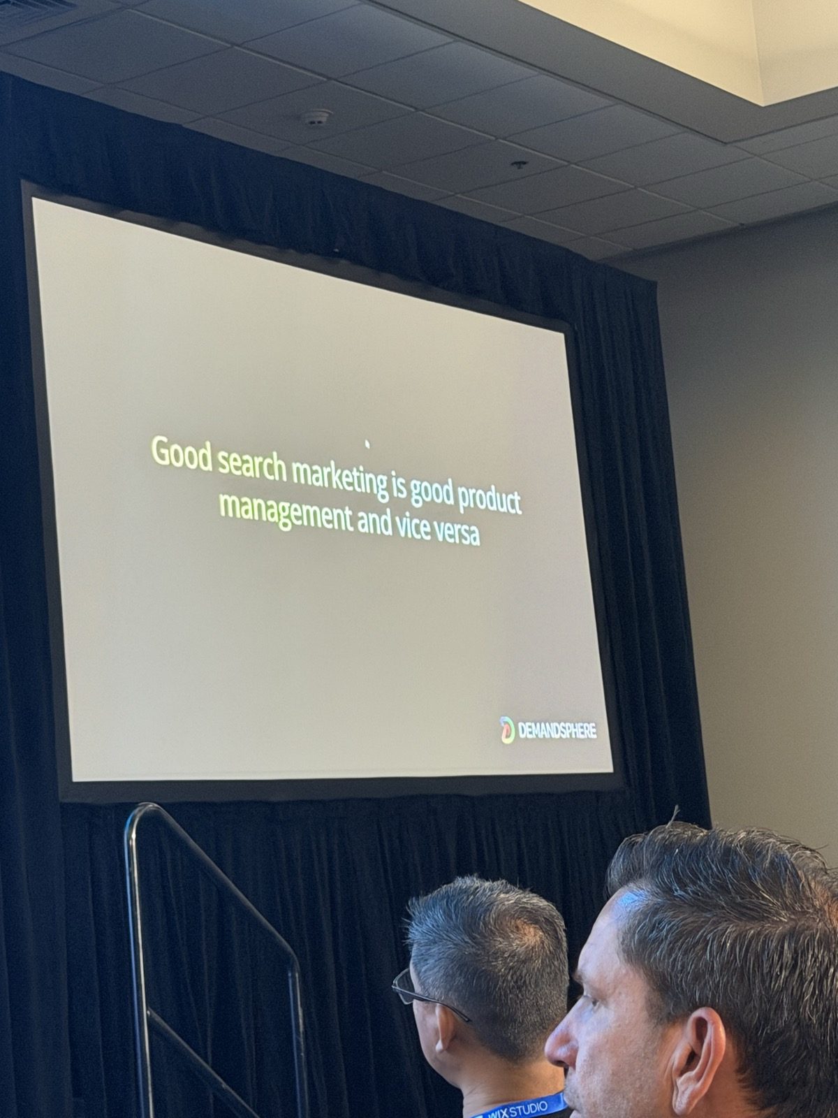 Slide con el texto 'Good search marketing is good product management and vice versa' y el logo de DemandSphere.